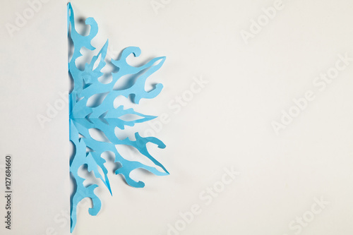 Fine paper snowflake cut out.