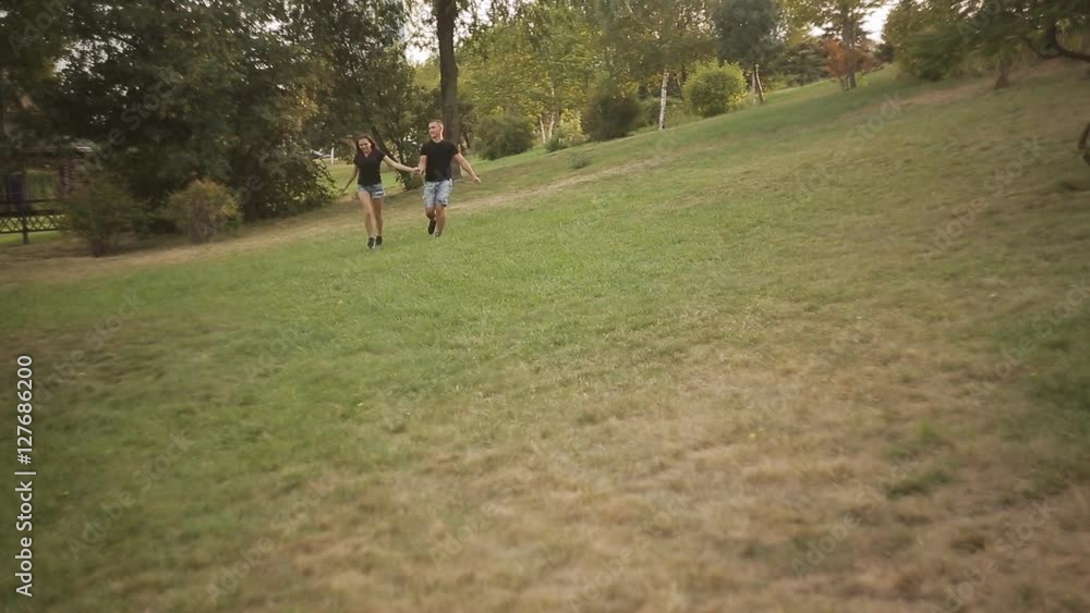 Young couple having fun in the park Young couple having fun in the park