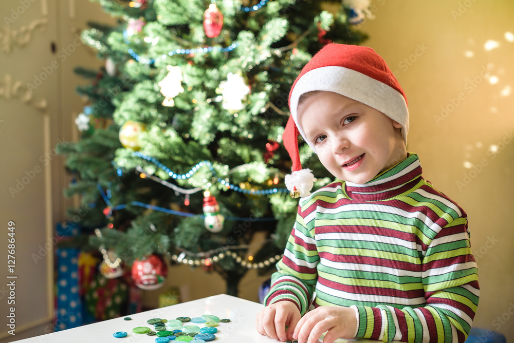 Kid child boy making by hands x-mas decorations Kid child boy making by hands x-mas decorations