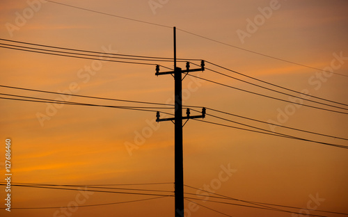 Silhouette power electric pole in evening time