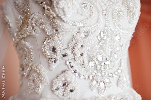 Closeup of brilliant and stones on wedding dress