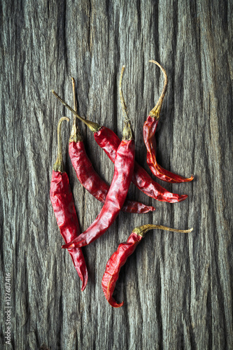 Dried Red Hot Chili Peppers on rustic wooden background, Overhea
