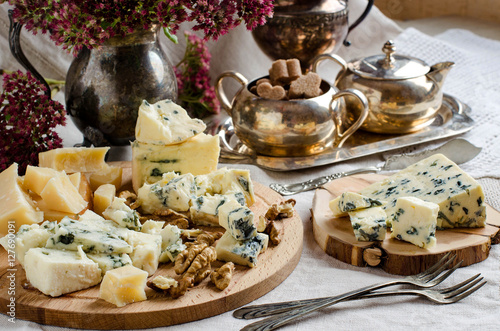 Assorted cheeses on the table.