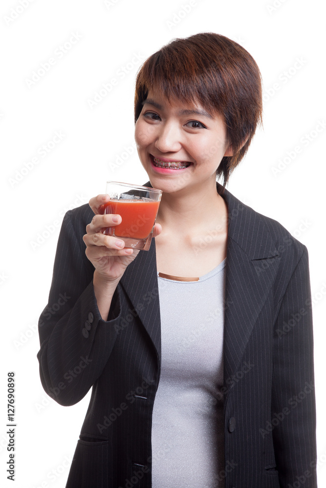 Young Asian business woman drink tomato juice. Young Asian business woman drink tomato juice.