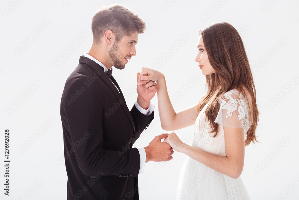 Groom kisses the bride's hand Groom kisses the bride's hand