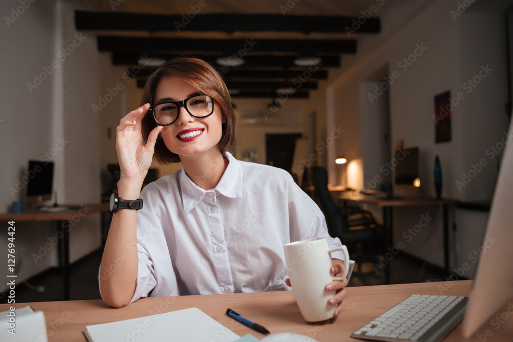 Office woman looking at the camera