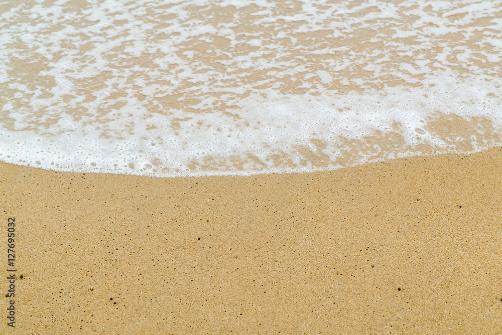 Soft wave on sand beach. Selective focus Soft wave on sand beach. Selective focus