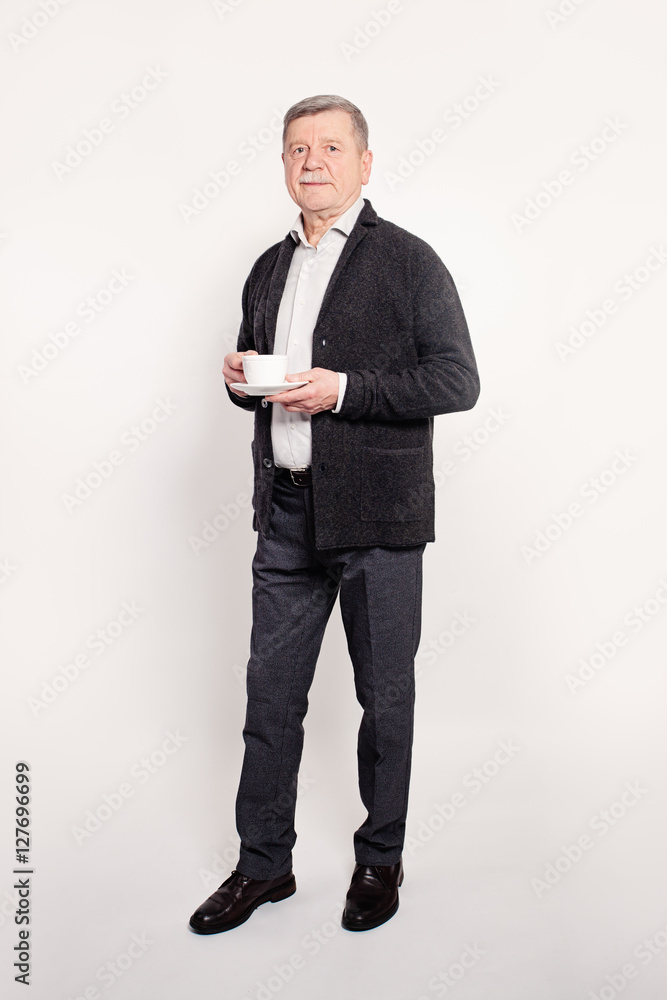 Senior Businessman Having a Break. Mature Man with a Cup of Coff Senior Businessman Having a Break. Mature Man with a Cup of Coff