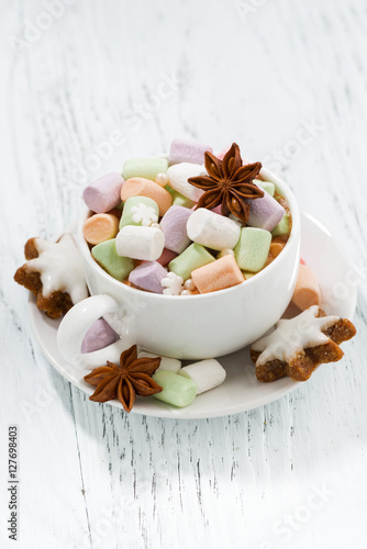 cocoa with colorful marshmallows and Christmas cookies top view