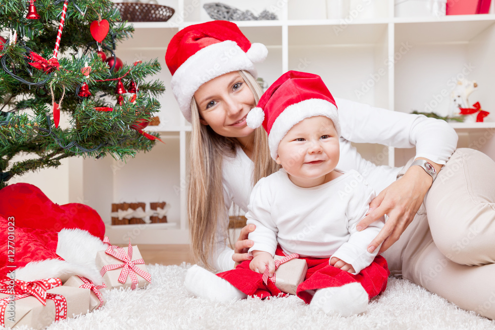 Mother with baby boy celebrating Christmas Mother with baby boy celebrating Christmas