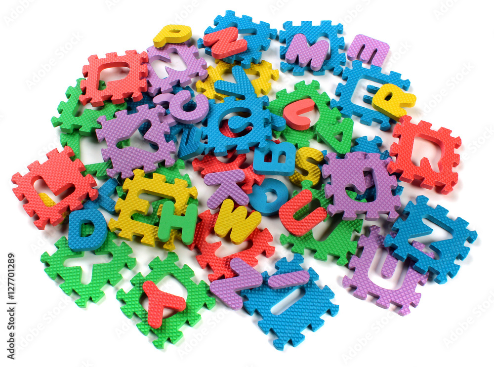 Obraz premium Cut out letters of toy plastic alphabet puzzle