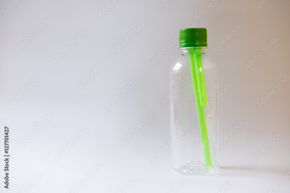 plastic bottle of water green straws inside plastic bottle of water green straws inside