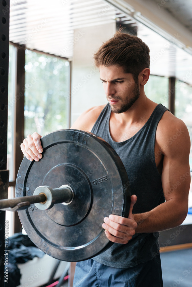 Fototapeta premium Healthy fitness man with barbells