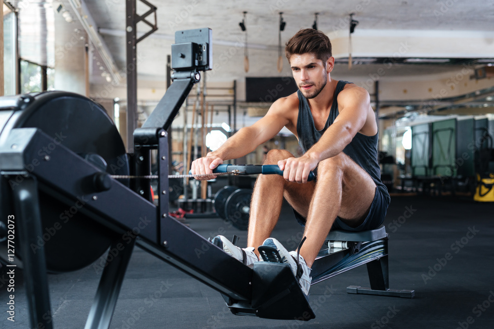 Fitness man doing exercise in gym Fitness man doing exercise in gym