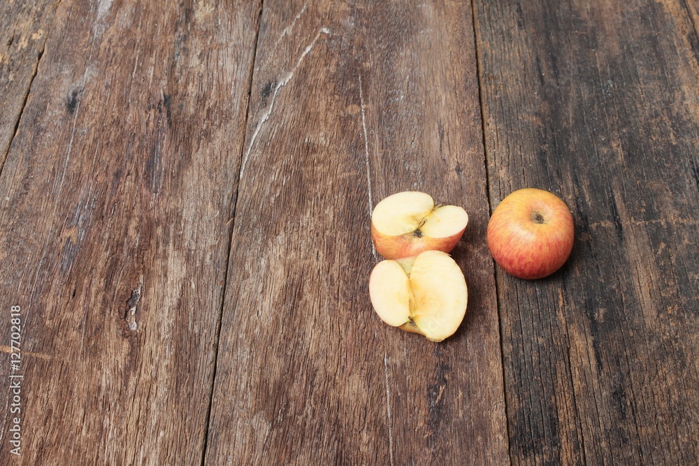 red apple and slice on wooden background, top view with copy space red apple and slice on wooden background, top view with copy space
