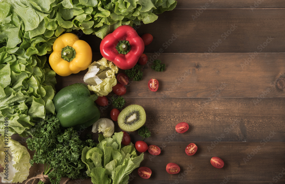 vegetables and fruit on wood background