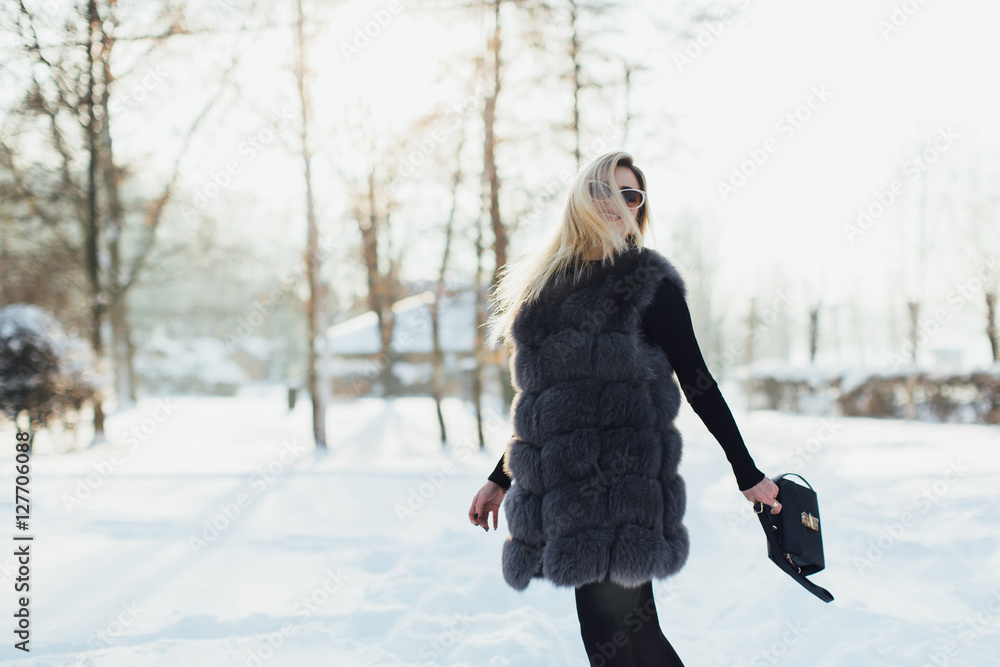 Portrait of a glamorous business woman in the winter street. Portrait of a glamorous business woman in the winter street.