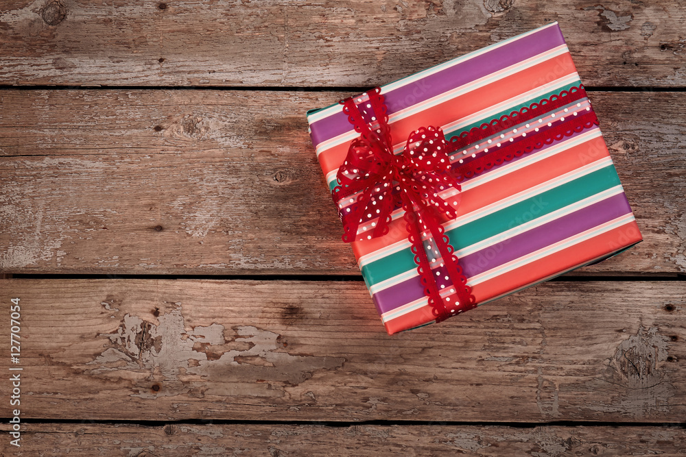 Fototapeta premium Vintage Christmas gift box on old wooden background.