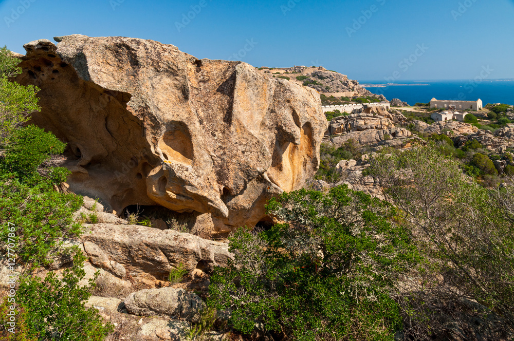 Weathered rocks of Sardinia and abandoned barracks