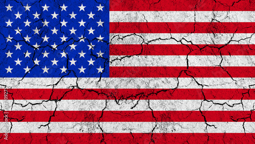 Flag of United States of America on rugged wall full of scratches - metaphor of problem and crisis leading to collapse of country photo