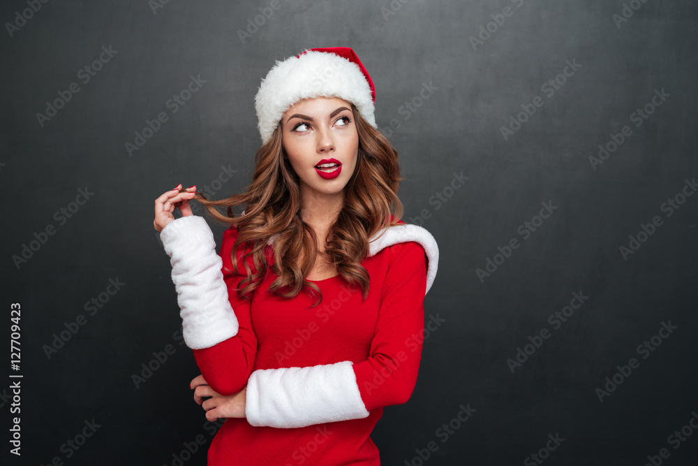 Mystery woman in christmas costume looking away Mystery woman in christmas costume looking away