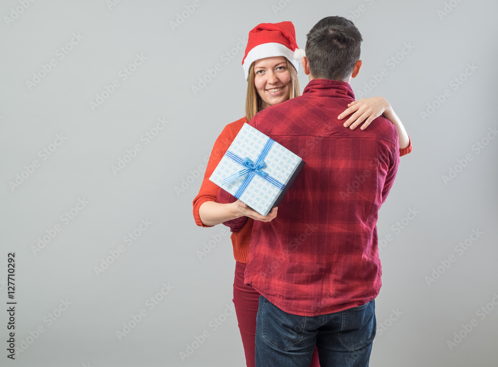 Happy couple with christmas present Happy couple with christmas present