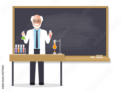 Senior science teacher teaching student in classroom