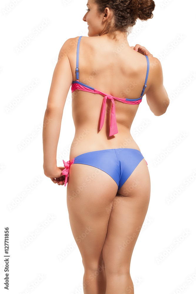 Slender girl in a swimsuit on white. Slender girl in a swimsuit on white.