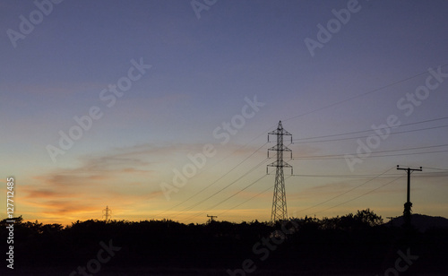 Electric pole on the background sky at sunset. © supanee2550