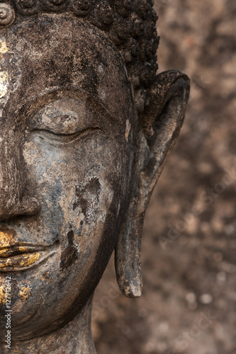 Buddha s face in the Wat Saphan Hin temple in Sukhothai historic