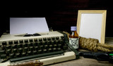 Typewriter with paper page and poison and gun. Concept writer Ro