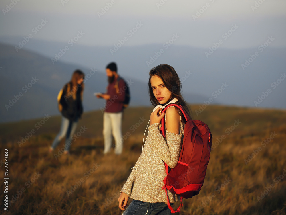 girl with backpack on mountain