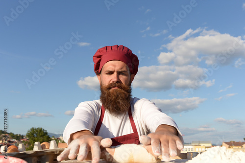 berded man chef cooking outdoor photo