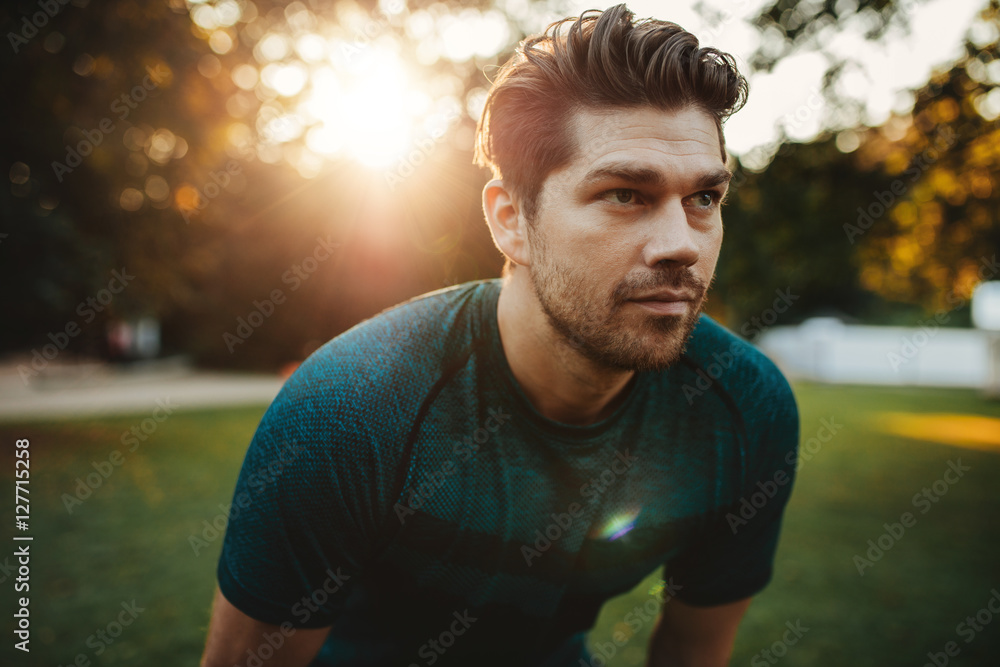 Healthy young man standing outdoors in park Healthy young man standing outdoors in park