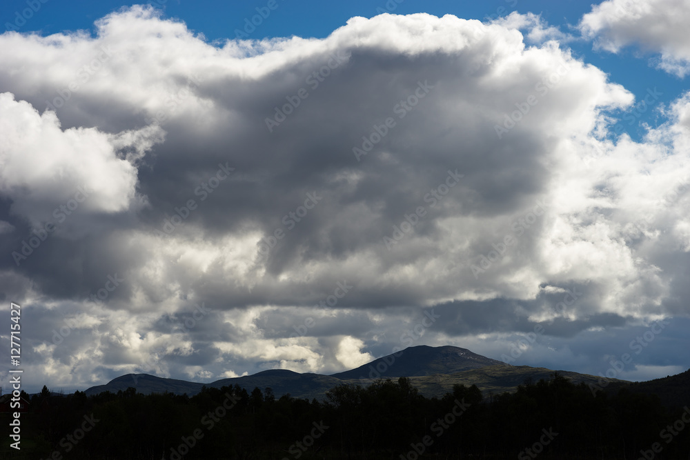 Norway mountains under heavy clouds background