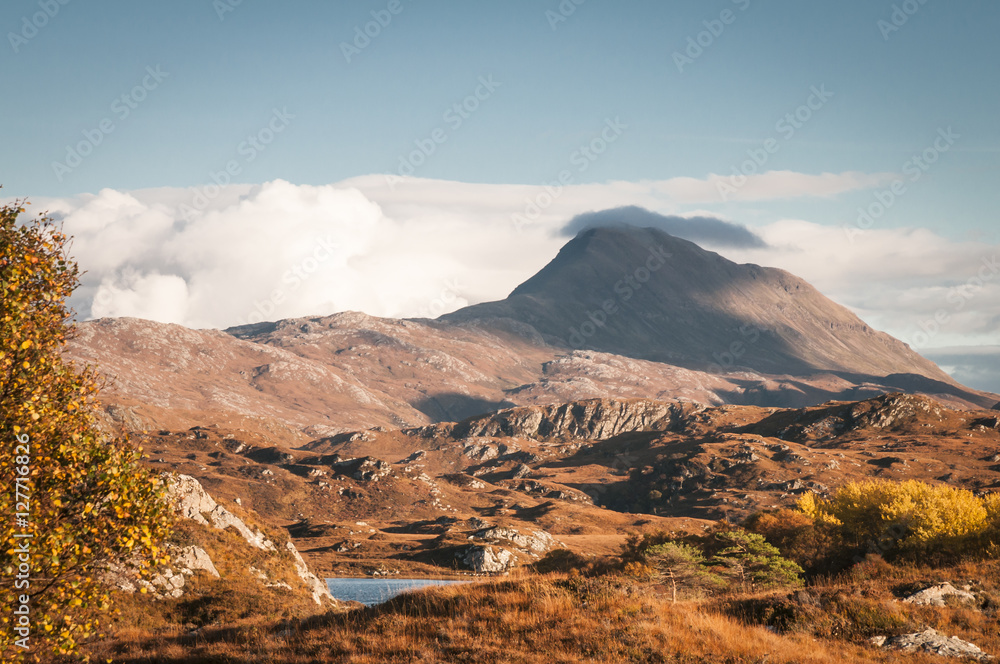 A landscape image of Canisp, a mountain in Assynt, in the Scottish highlands.
