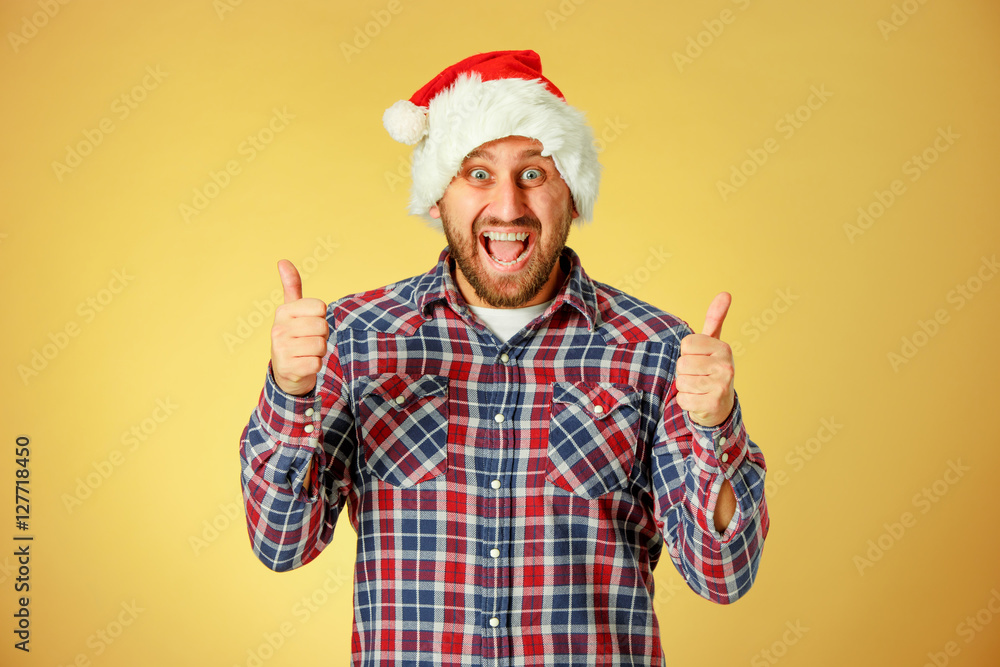 Smiling christmas man wearing a santa hat Smiling christmas man wearing a santa hat