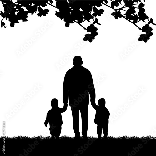 Grandfather walking with grandchildren in the park, one in the series of similar images silhouette