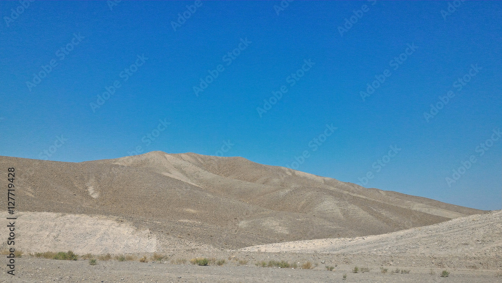 Desert and layers of mountain, majestic landscape in Iran Desert and layers of mountain, majestic landscape in Iran