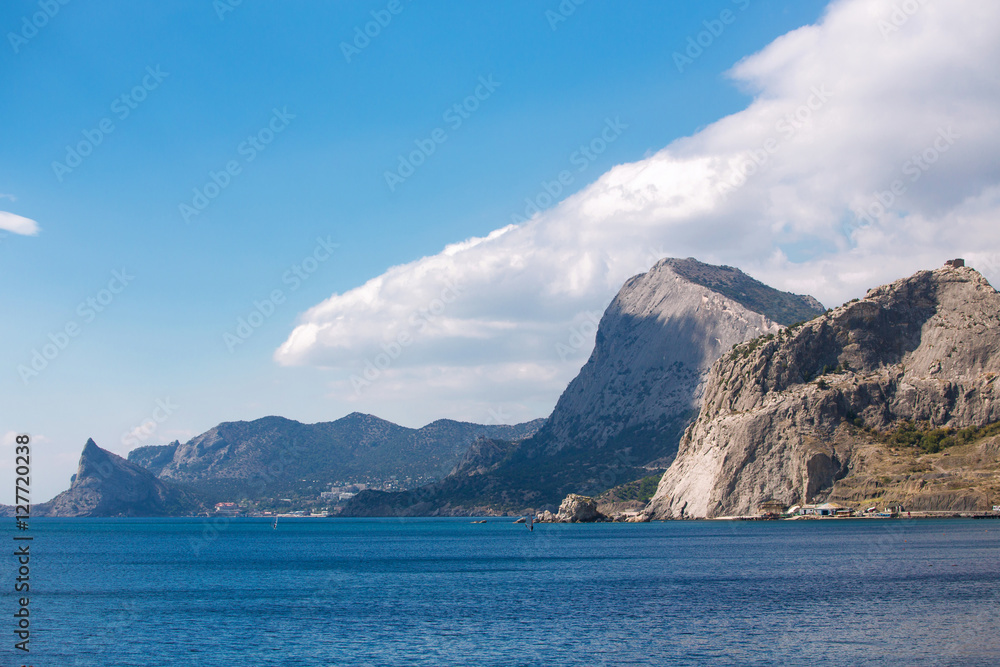 Fototapeta premium Sea and mountains against the sky