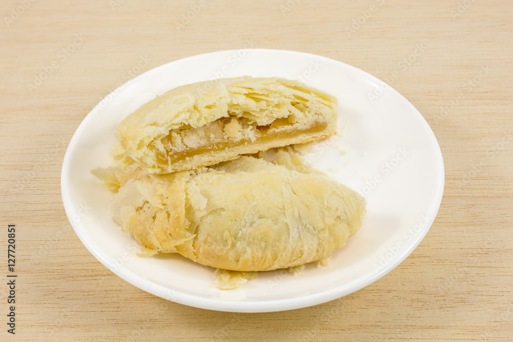 The Taiwanese sun cake (milk butter pastry) on the small white dish.