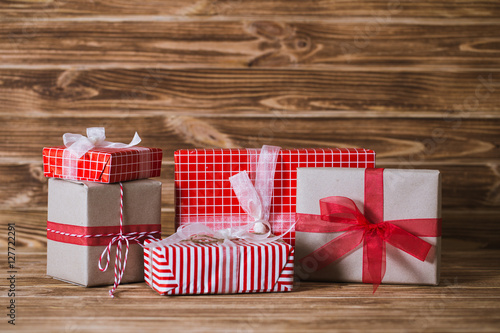 Christmas gift boxes on a wooden background