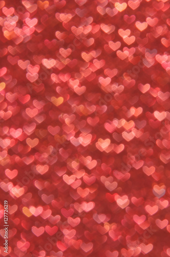 defocused abstract red hearts light background