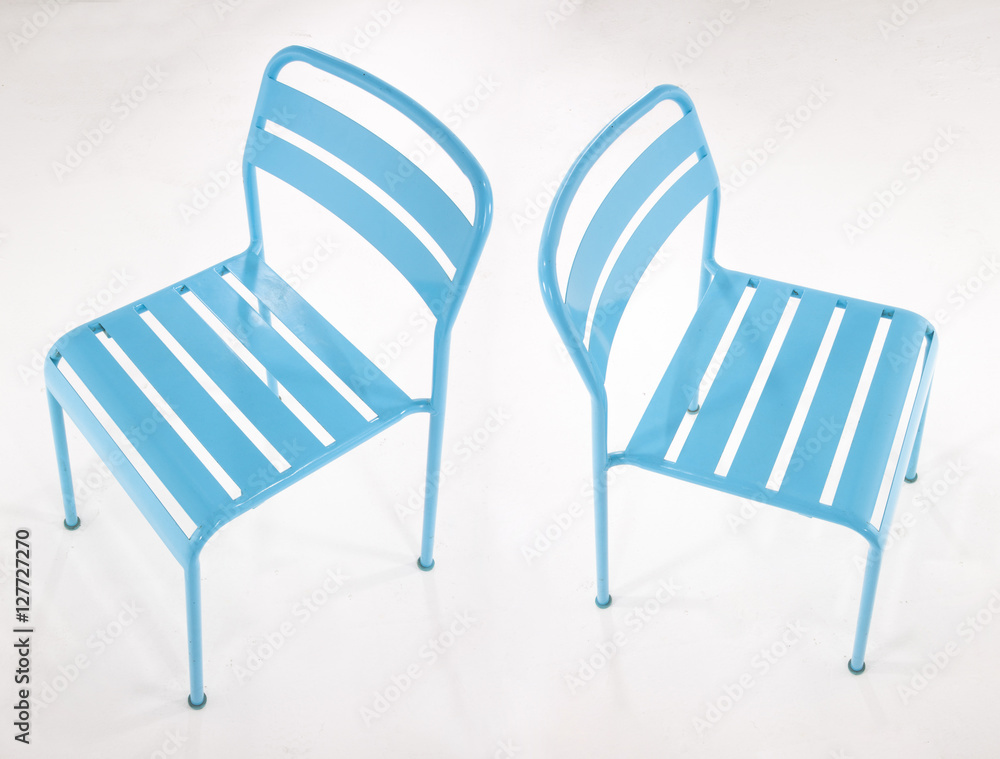 Turquoise metal chairs on white Turquoise metal chairs on white