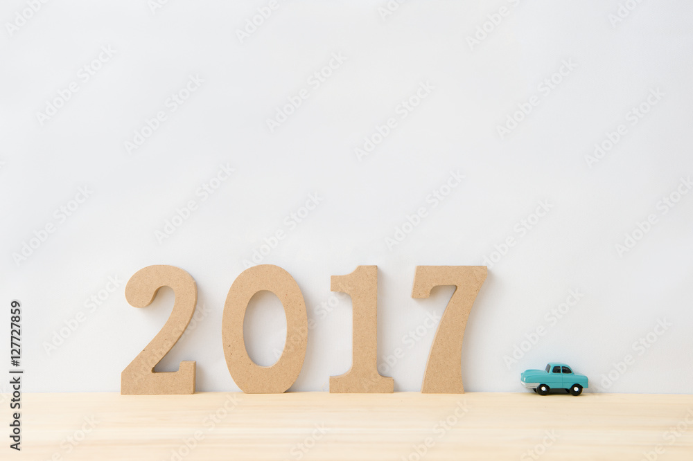 Happy New Year 2017 on a white background,On the right there is a car model Happy New Year 2017 on a white background,On the right there is a car model