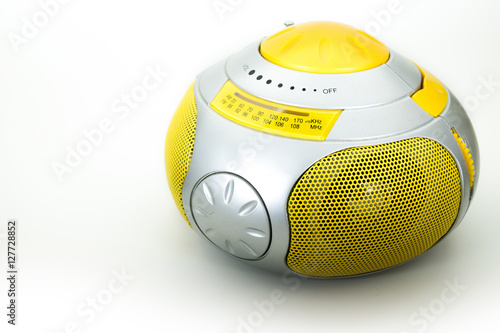 a yellow modern radio in a white background, isolated
