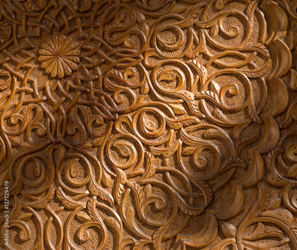 Woodcarving detail of the entrance to the Palace of the Counts of Cervellon arabic pattern close-up