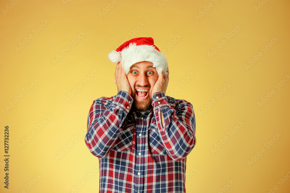 Smiling christmas man wearing a santa hat Smiling christmas man wearing a santa hat