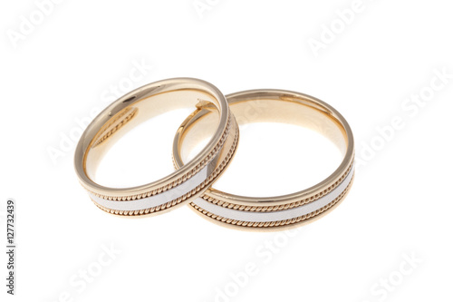 Golden wedding rings, isolated on white