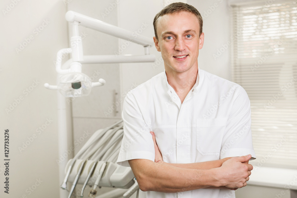 attractive dentist in white uniform